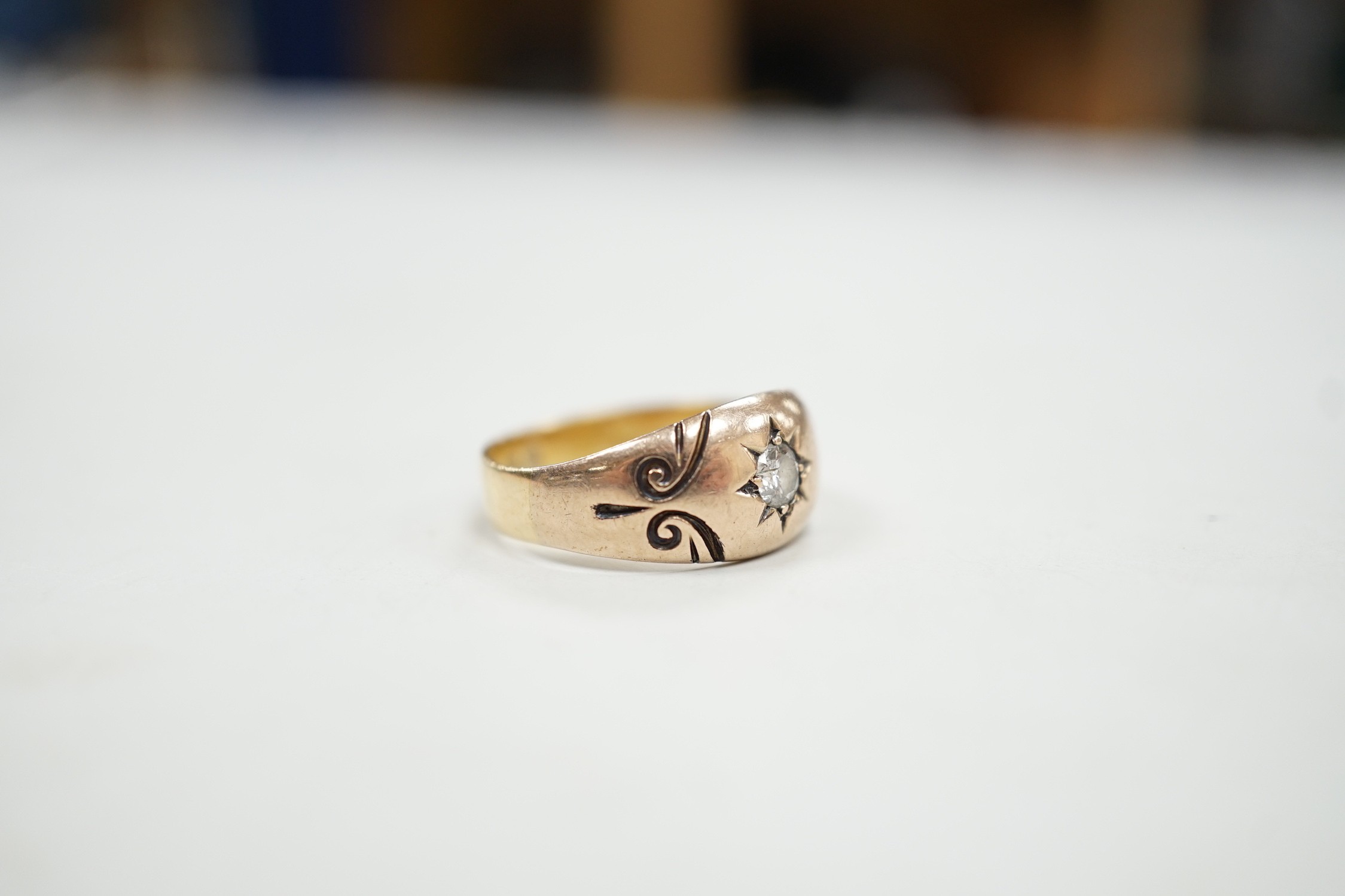 A Victorian 18ct gold and gypsy set solitaire diamond ring, size O, gross weight 3.9 grams.